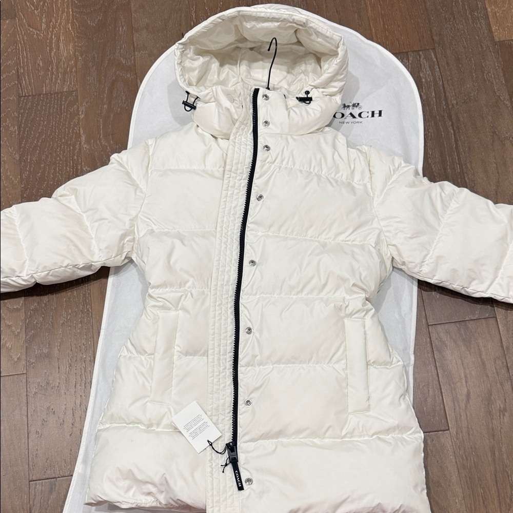 Coach Luxurious Women Lined Puffer Coat with zipper pockets, adjustable